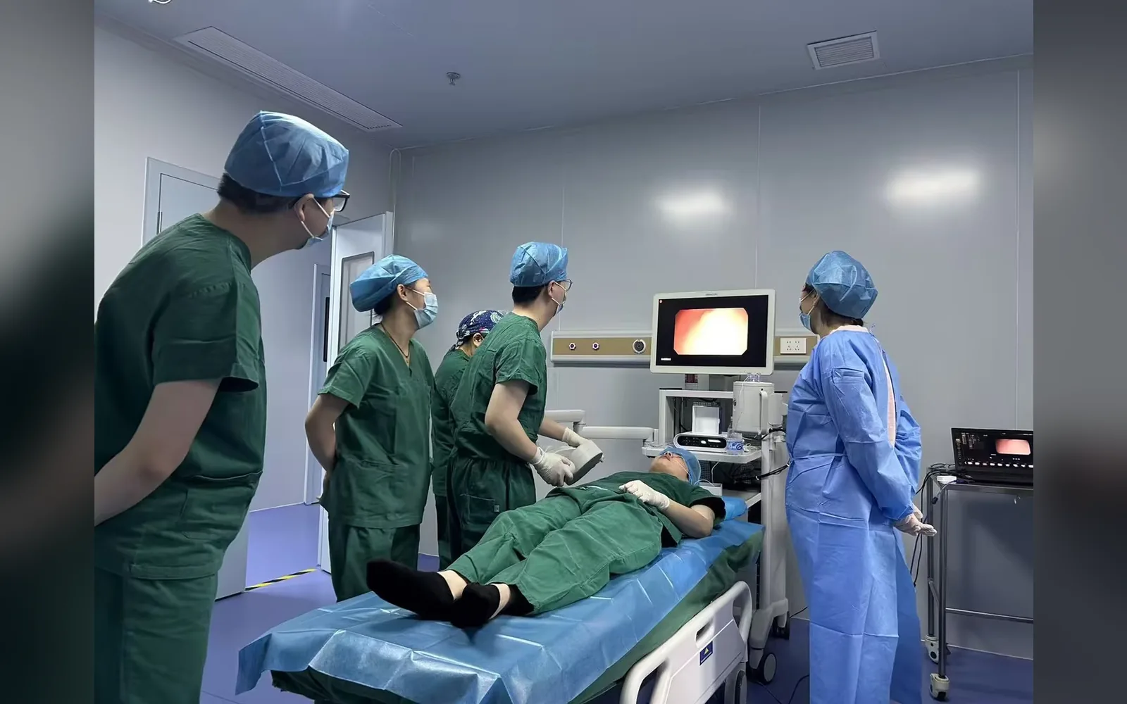 A clinical team uses the AICAM system in an upper GI tract examination setting.