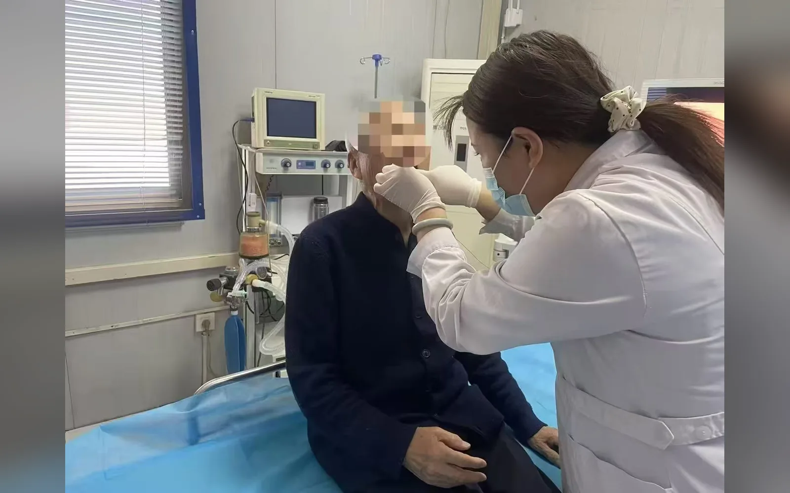 A healthcare professional performs an AICAM examination in a clinical setting.