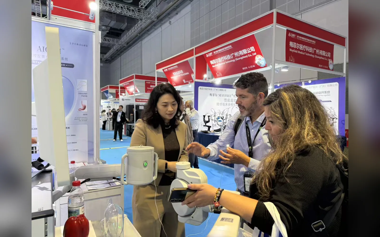 Visitors participate in an AICAM system demonstration at an international exhibition.